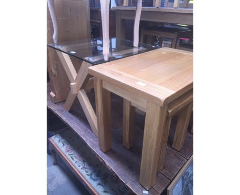 A modern light oak and glass coffee table and light oak nest of two tables 