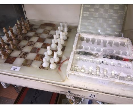 Two chess sets with boards 
