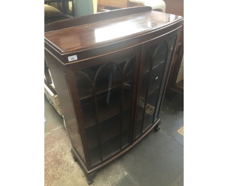 A mahogany glazed bow front display cabinet 
