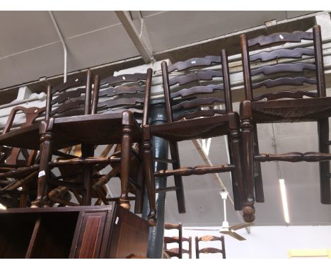 A set of four rush seated ladder back chairs 
