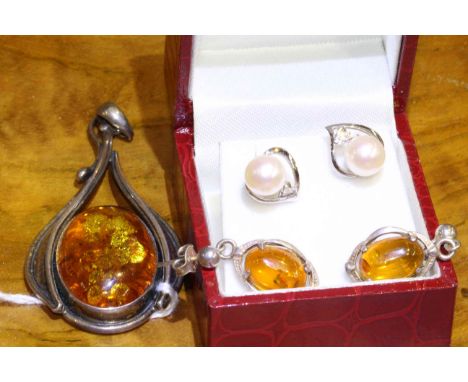 Pair of white gold, cultured pearl and diamond earrings; together with suite of sterling silver mounted and amber coloured je