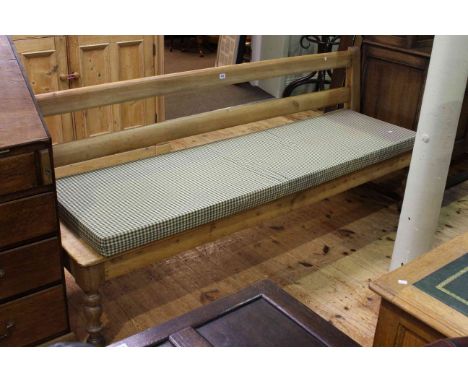Stripped pine bench, with turned baluster legs, 203cm