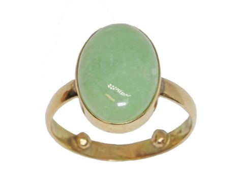 A jadeite jade cabochon ring, the bezel set cabochon measuring approximately 16mm x 6mm, yellow band marked '14K585', gross w