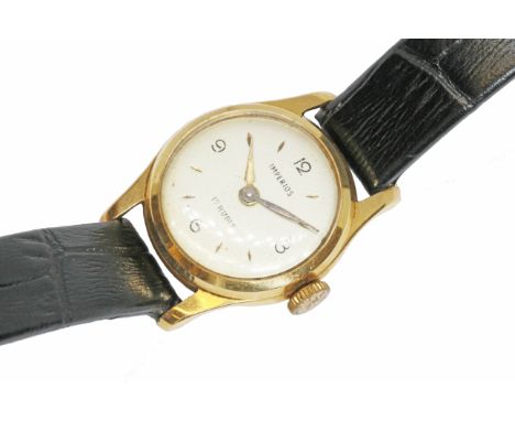 A ladies 18ct gold Imperios 17 jewel manual wind wristwatch with leather strap.  Condition - winding, ticking, advancing fine