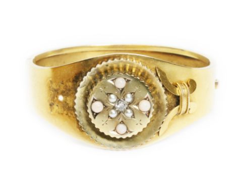 A Victorian diamond and split pearl bangle, the Old Mine cut diamond weighing approximately 0.20cts, yellow metal unmarked, d