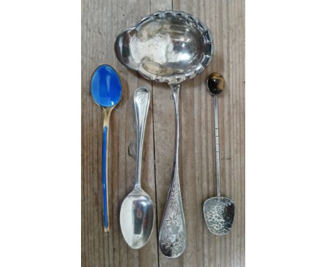 Foreign silver comprising a silver gilt blue enamel spoon, a ladle and a spoon with tiger's eye finial marked 'Sterling', tog