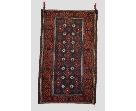 Baluchi rug, Khorasan, north east Persia, late 19th/early 20th century, 5ft. X 3ft. 1in. 1.52m. X 0.94m. Some wear with corro