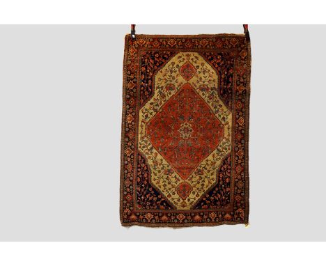 Saruk rug, north west Persia, early 20th century, 5ft. 1in. X 3ft. 5in. 1.55m. X 1.04m. Some wear in places with corrosion to