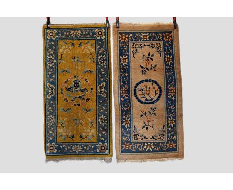 Two Chinese rugs, the first: Tianjin rug, north west China, circa 1940s-50s, 5ft. X 2ft. 6in. 1.52m. X 0.76m. Small spots of 