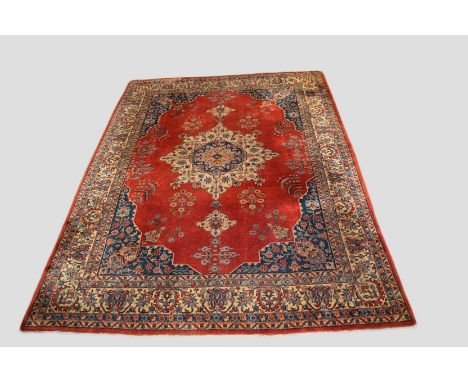 Tabriz carpet, north west Persia, circa 1930s-40s, 12ft. 4in. X 9ft. 3.76m. X 2.75m. Some wear in places. Light terracotta fi