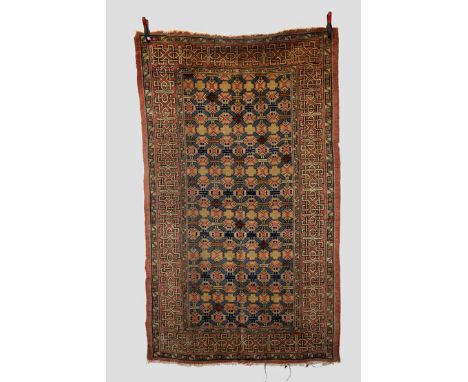 Khotan rug, Xinjiang, east Turkestan, early 20th century, 7ft. 8in. X 4ft. 6in. 2.34m. X 1.37m.  Overall wear; small areas of