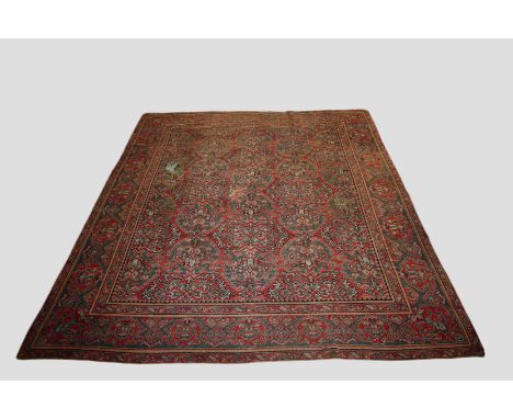 Ushak carpet, west Anatolia, early 20th century, 13ft. 6in. X 11ft. 1in. 4.12m. X 3.38m.  Overall wear, heavier in some place