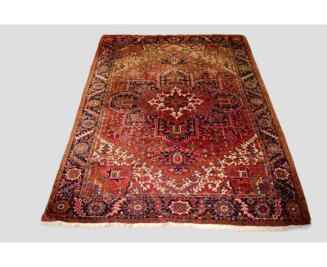 Heriz carpet, Gorevan area,  north west Persia, circa 1940s-50s, 11ft. 8in. X 8ft. 10in. 3.56m. X 2.69m. Sun fading to top en