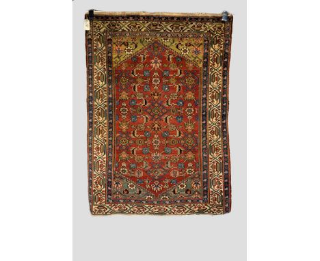 Hamadan rug, north west Persia, early 20th century, 4ft. 6in. X 3ft. 2in. 1.37m. X 0.97m. Overall even wear; corrosion to dar