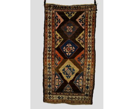 Kurdish rug, north west Persia, early 20th century, 6ft. 5in. X 3ft. 8in. 1.96m. X 1.04m. Overall wear; fraying to sides. Dar