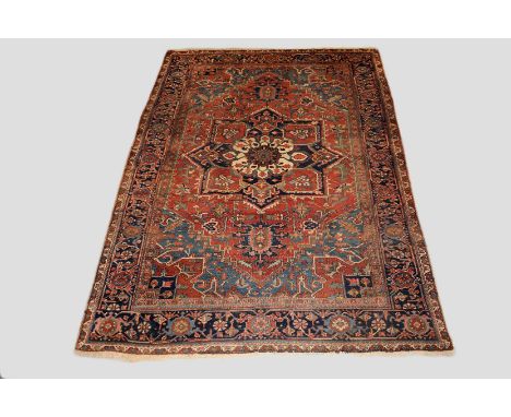 Heriz carpet, north west Persia, circa 1920s, 11ft. 5in. X 8ft. 1in. 3.48m. X 2.46m. Slight wear in places; slight loss to en