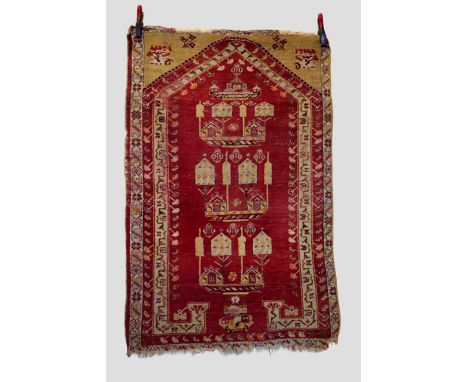 Kirsehir prayer rug of Mezarlik design, central Anatolia, late 19th/early 20th century, 5ft. 1in. X 3ft. 4in. 1.55m. X 1.02m.
