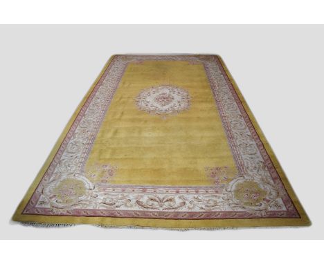 Indian carpet, mid-20th century, 232ft. X 12ft.  3in. 7.01m. X 3.73m.  Some surface marks, especially at the top end..  Pale 