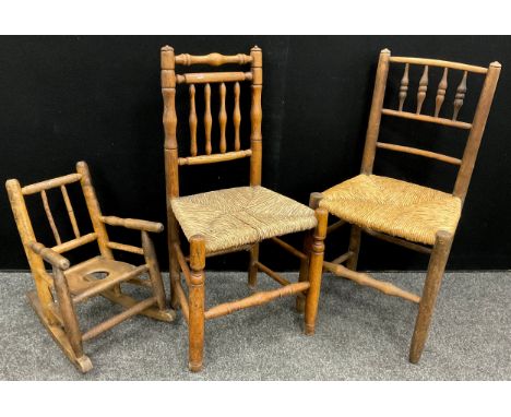 A childs stick back rocking chair, turned arms, slope back seat;  19th century rush seated side chair etc  (3) 