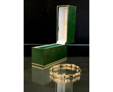 A 9ct gold hinge bangle, 4g gross, boxed 