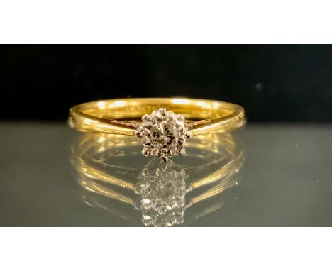 A diamond solitaire ring, round brilliant cut diamond approx 0.12ct, 18ct gold and platinum shank, size M, 2.9g gross 