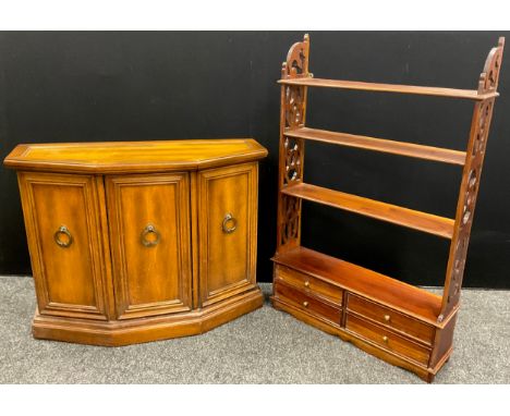 A mahogany wall-mounted four tier shelf, with four short drawers to base, fretwork sides, 113cm high x 73cm wide x 18.5cm dee