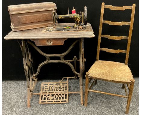 A Jones Vintage treadle sewing machine, the ‘Family Machine’ model, no. 44520, on a cast iron treadle base;  a late 19th cent