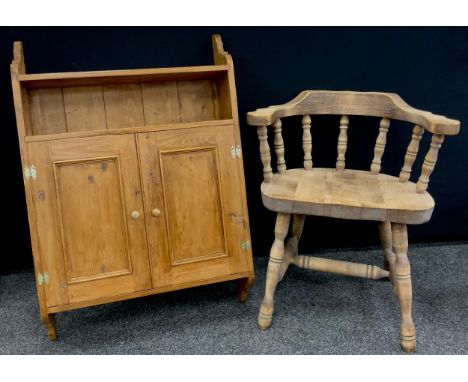 A pine wall mounted cupboard / shelf, and a Smoker’s bow spindle-back chair, (2). 