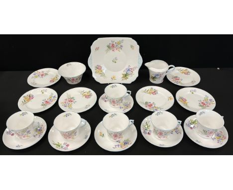 A Shelley ‘Wild flowers’ pattern tea set for six comprised of six tea cups and saucers, conforming six side plates, milk jug,