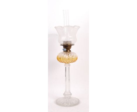 A stunning 19th Century Victorian oil lamp having an intricately decorated etched handkerchief glass shade over brass twin Yo