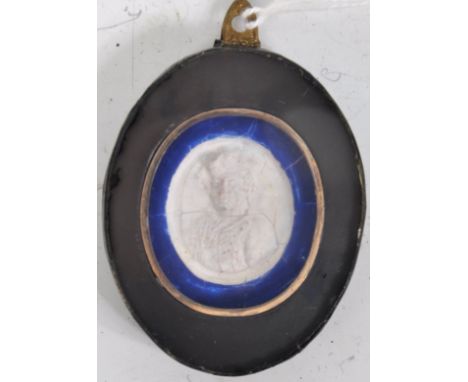 An antique 18th Century Swedish miniature wax / plaster portrait of Charles 12th of Sweden set to a lacquered oval frame with
