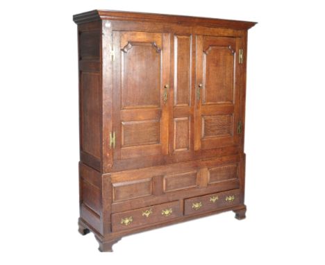 A large 19th Century Dutch antique oak livery housekeepers cupboard having a twin door cupboard with fitted shelf interior.&n