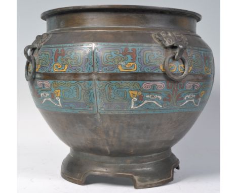 An early 20th Century large antique Chinese bronze cloisonne footed planter having bands of enamel coloured decorations and f