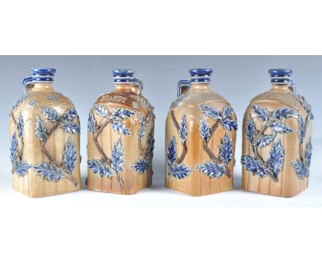 Charles Bailey - Fulham Pottery - A rare complete set of four 19th Century Victorian stoneware flagon bottle decanters compri