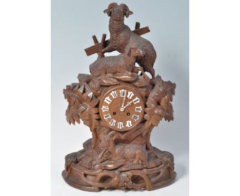 A stunning fine quality 19th Century antique German Black Forest hand carved mantel table clock. A pair of beautifully carved