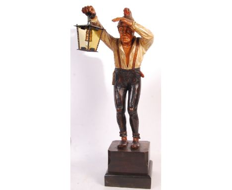 An impressive early-mid 20th century Black Forest carved figure of a gatekeeper. Carved into the form of a man, complete with