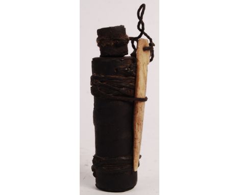 An unusual 19th century antique African potion / poison bottle - likely used by a witch doctor or spiritual healer. Carved wo