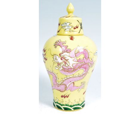 A Chinese Republic Period or later porcelain Qianlong mark vase and cover of Meiping shape with famille jaune yellow enamel g