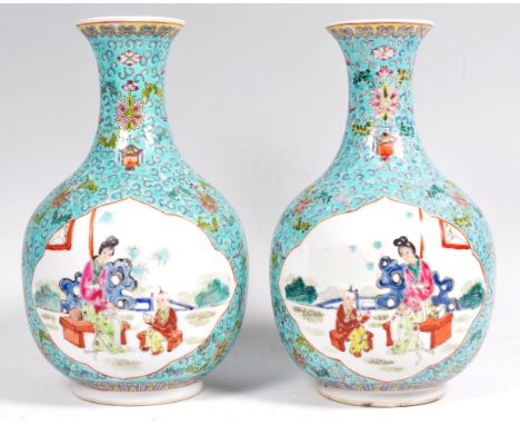 A pair of early 20th Century Chinese Republic Period porcelain vases of baluster shape having a turquoise enamel ground decor