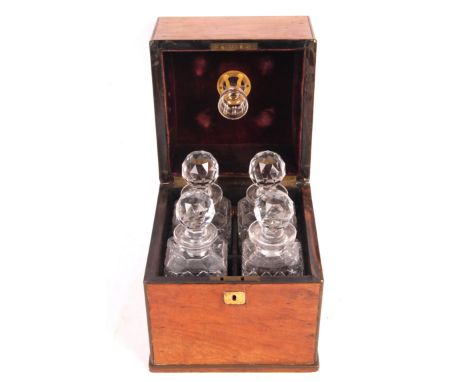 A 19th Century antique mahogany quadruple decanter box of square form having campaign recessed handles to sides and brass ins