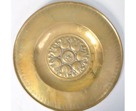 An antique 17th century style brass Nuremberg Bavarian Alms Dish / Basin. The central bowl decorated with a central floral mo