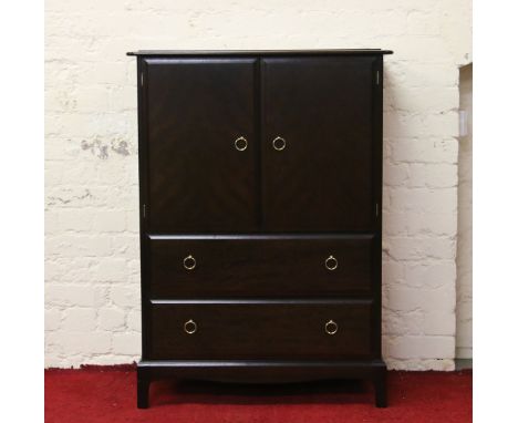 A Stag Minstrel mahogany linen cupboard raised on bracket feet. 