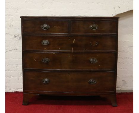 A Regency mahogany bowfronted chest of two over three drawers raised on splayed bracket feet.