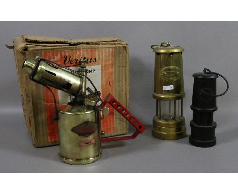 A brass cased miners lamp by Limelight Company Hockley along with similar carved coal example and a boxed blow lamp.