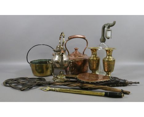 A collection of metalwares to include spirit kettle antique copper kettle, soda syphon carpet beater etc.