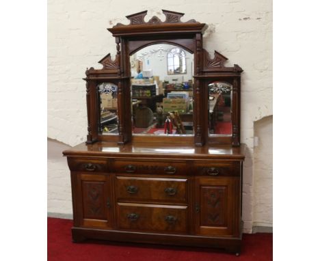 A Victorian carved walnut mirror back sideboard raised on bracket feet.