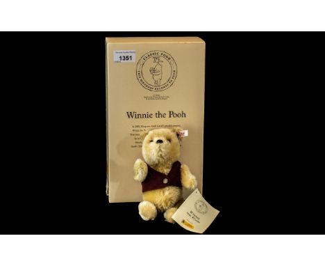 Steiff 'Winnie The Pooh', with original box and certificate.  Limited edition No. 02974, Serial No. 680090.  Approx. 8" tall.