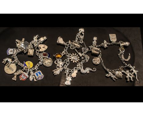Three Vintage Sterling Silver Charm Bracelets loaded with 40 silver charms all marked for Sterling silver various subjects. A