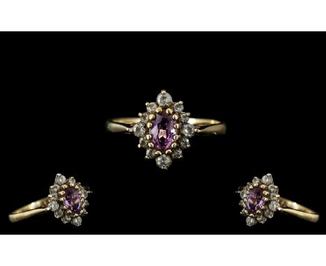 Ladies - Attractive 9ct Gold Amethyst and Diamond Set Dress Ring. Fully Hallmarked for 9.375. The Amethyst Surrounded by 11 D