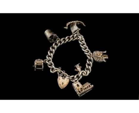 Vintage Silver Heavy Charm Bracelet, a chunky bracelet with very good charms including a Stanhope, champagne bucket, mangle e